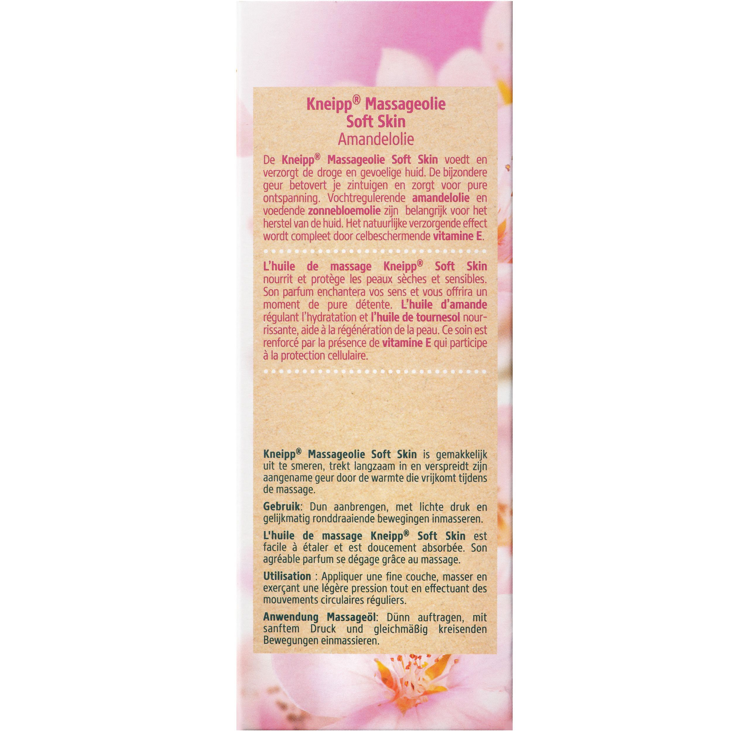 Roze verpakking met tekst. Opschrift: Kneipp Massageolie Soft Skin, Amandelolie. Tekst in het Duits, Frans en Nederlands. Bloemenachtergrond.