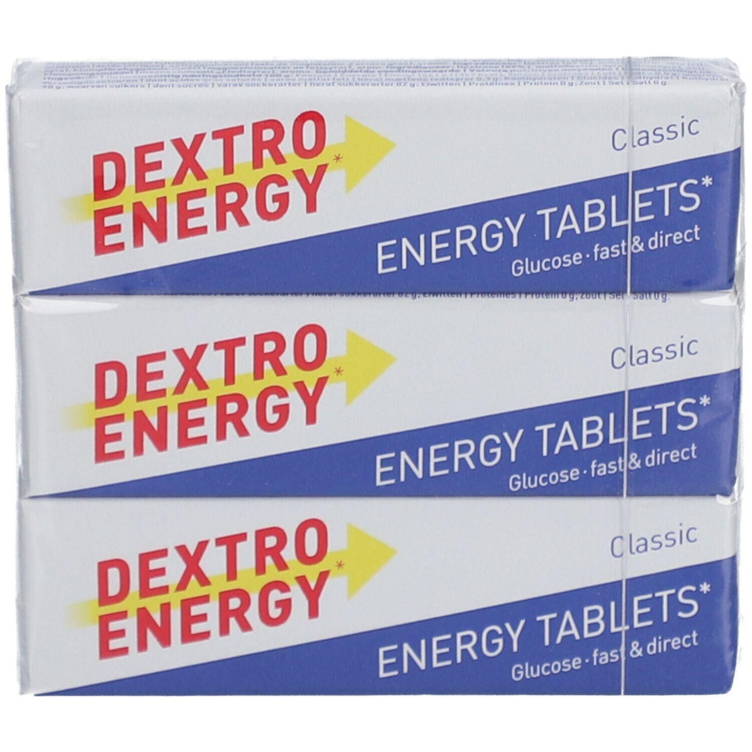 Trois paquets de « Dextro Energy » et « Energy Tablets ». Emballage bleu et blanc avec une flèche jaune. « Classic ».