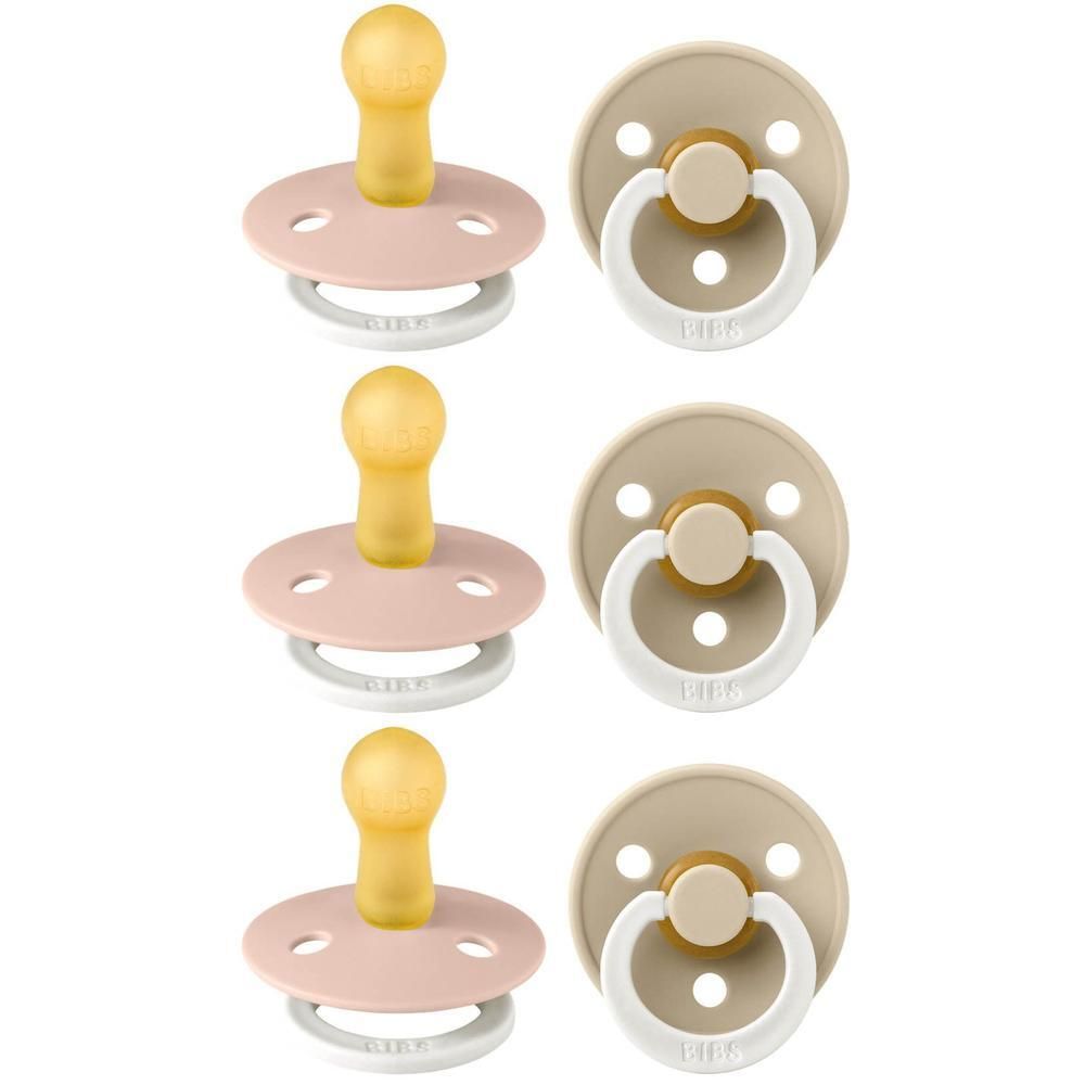 Six sucettes, trois roses et trois beiges. Forme ronde, tétine en latex, anneau et bouclier.