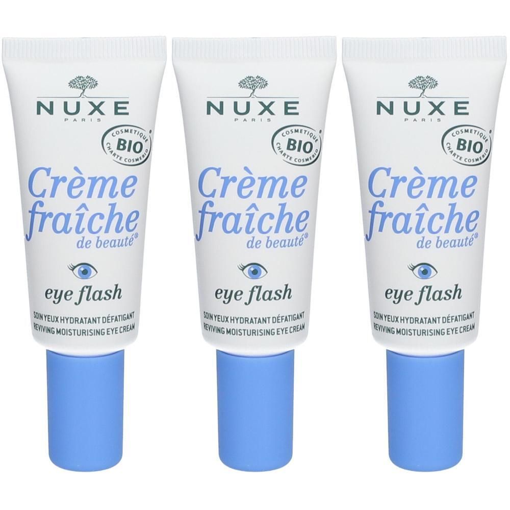 Drie tubes Nuxe Crème Fraîche de Beauté Eye Flash. Witte tubes met blauwe dop. Opschrift: Crème fraîche de beauté, eye flash.