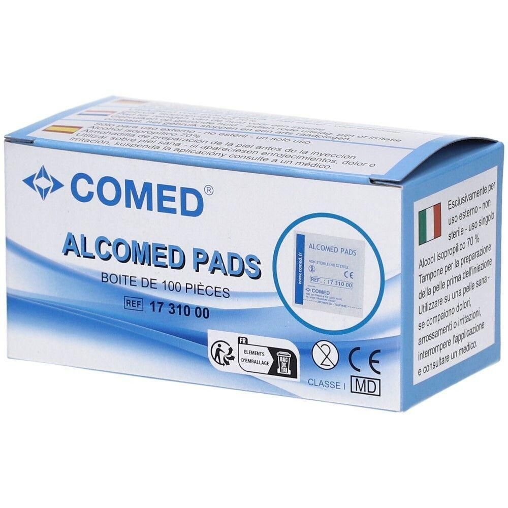 Boîte de pads Alcomed. Inscriptions : COMED, ALCOMED PADS, BOITE DE 100 PIECES. Marquage CE visible.