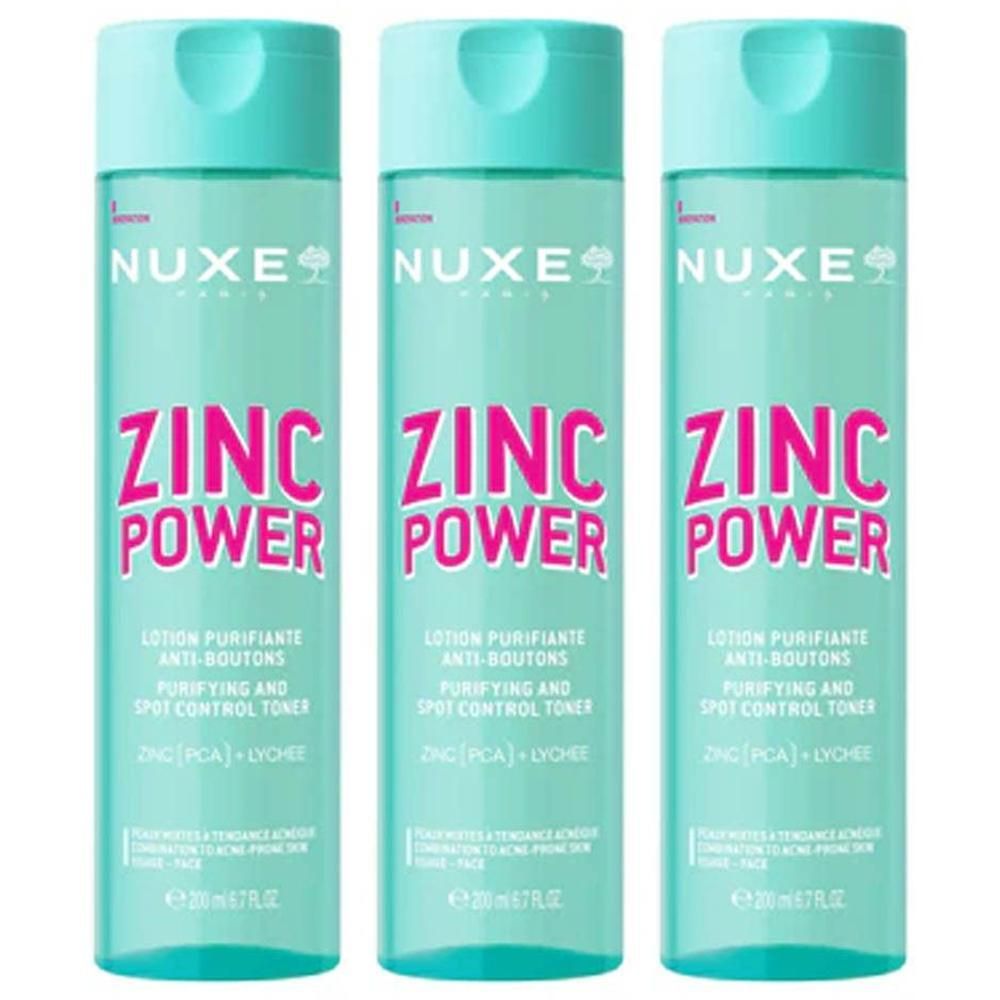 Trois flacons de lotion Nuxe Zinc Power. Flacons turquoise avec bouchon bleu clair. Inscription : ZINC POWER, Lotion Purifiante Anti-Boutons.