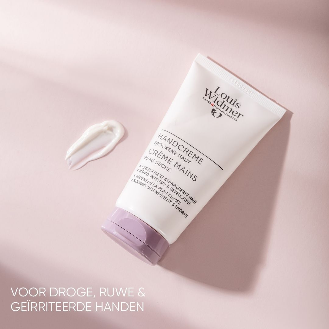 Louis Widmer Handcreme tube en crèmevlek. Wit, paarse dop. Tekst: Handcreme, Crème Mains, voor droge huid.