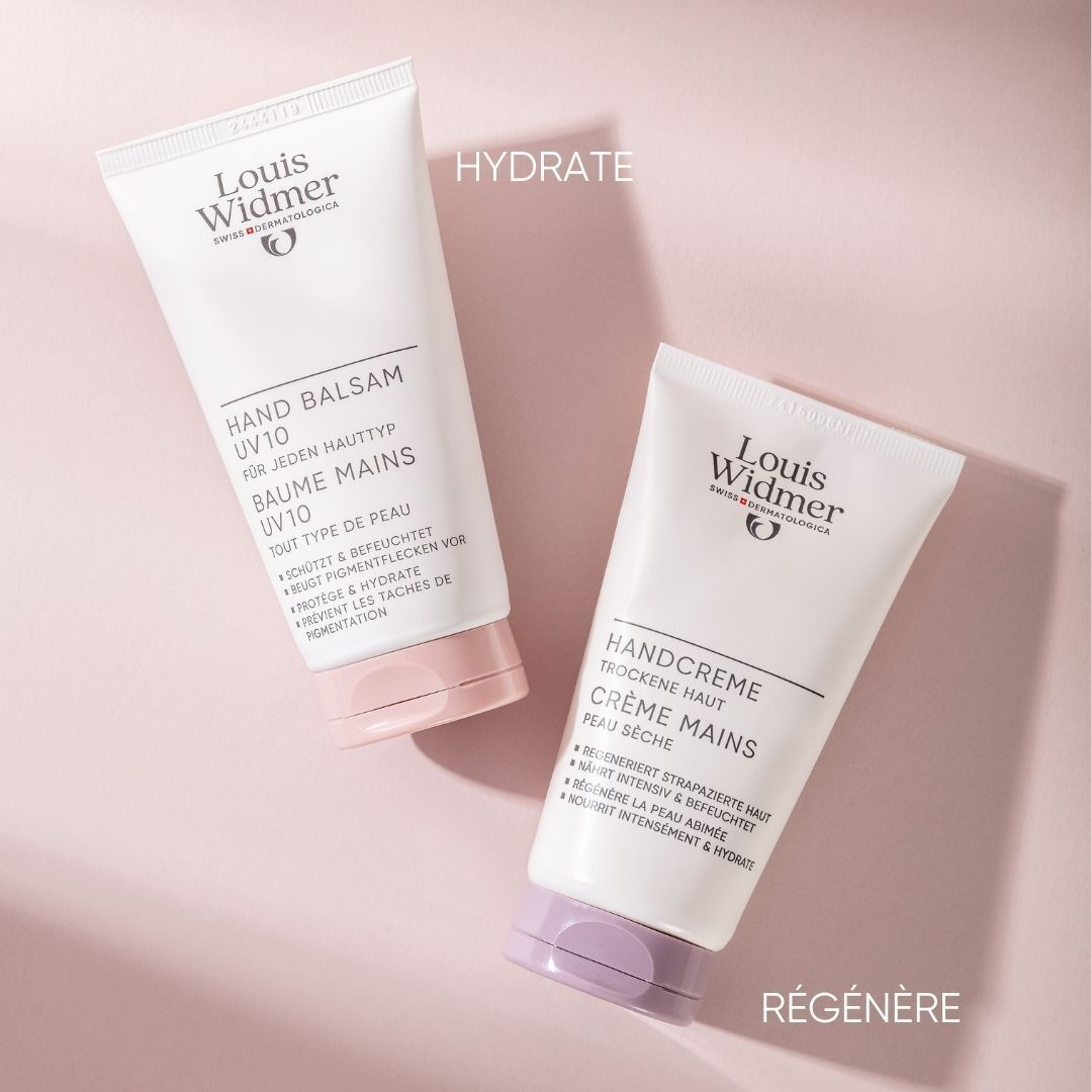 Deux tubes Louis Widmer. Hand Balsam UV10 et Handcreme. Blanc, bouchons rose et violet. Texte: Handcreme, Baume Mains.