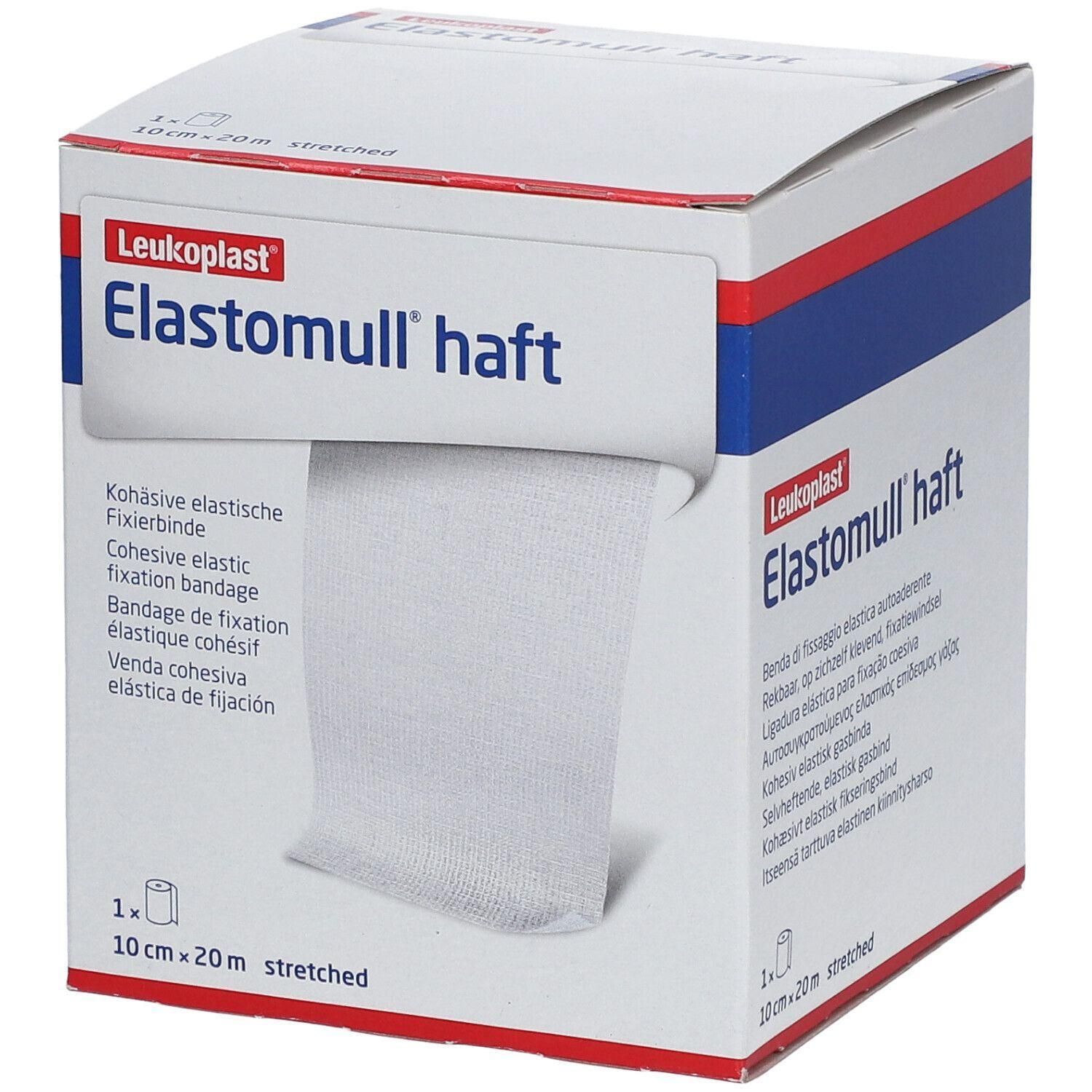 Witte bandage in een doos. Tekst "Elastomull haft" en "Leukoplast". Bevat 1 rol, 10 cm x 20 m.