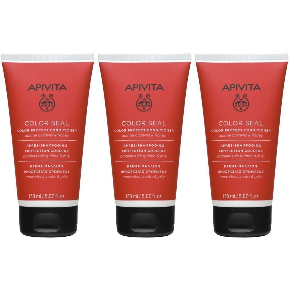 Trois tubes de Apivita Color Seal Après-Shampooing. Tubes rouges avec bouchon blanc et fermeture noire. Nom du produit et logo visibles.