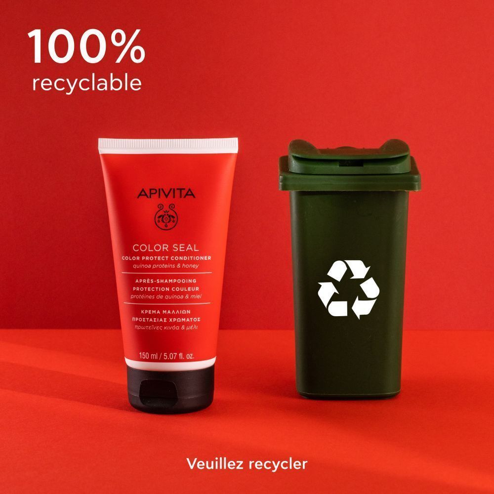 Apivita Color Seal Après-Shampooing à côté d'une poubelle de recyclage verte. Texte : 100% recyclable.