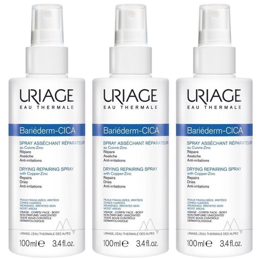Trois flacons spray blancs avec étiquettes bleues et blanches. Inscription: Uriage, Bariéderm-Cica, Spray.