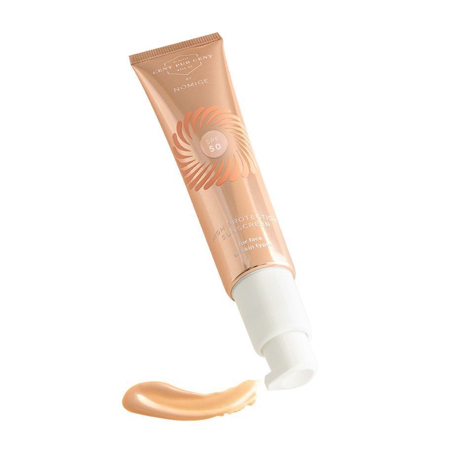 Cent Pur Cent by Nomige SPF50 tube. Roségouden tube met SPF50-logo en producttekst. Zonnebrandvlek.