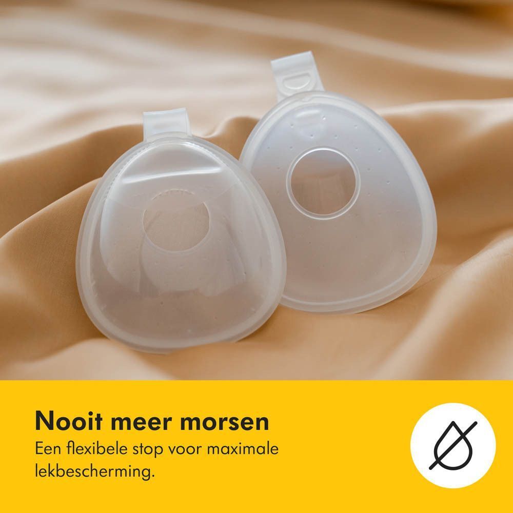 Twee transparante Medela InBra Breast Milk Collectors. Tekst: Nooit meer morsen.