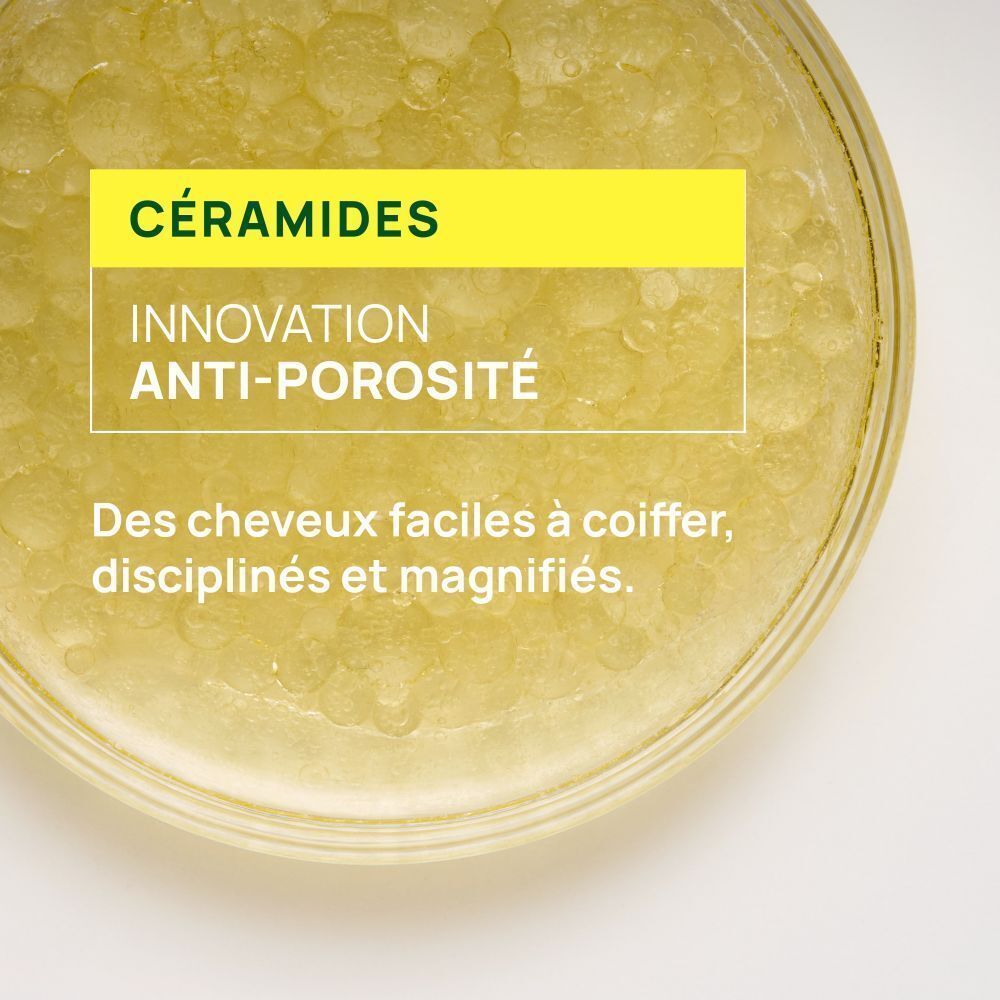 Bol de liquide. Texte : Céramides. Innovation anti-porosité. Des cheveux faciles à coiffer, disciplinés et magnifiés.