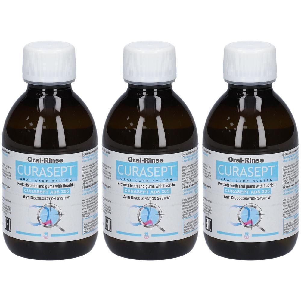 Trois flacons bruns avec bouchons blancs. L'étiquette indique CURASEPT Oral-Rinse.
