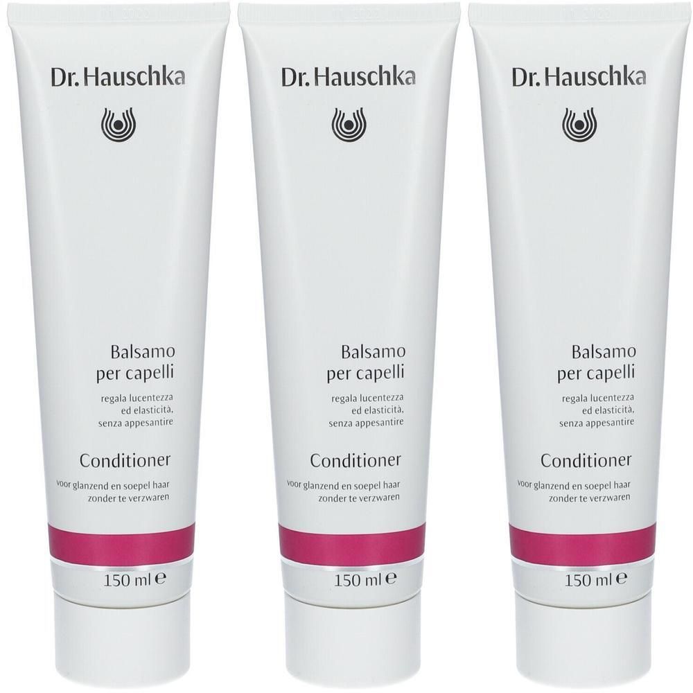 Trois tubes de Dr. Hauschka Après-Shampooing. Tubes blancs avec bande rose et texte. Inscription : Balsamo per capelli, Conditioner.
