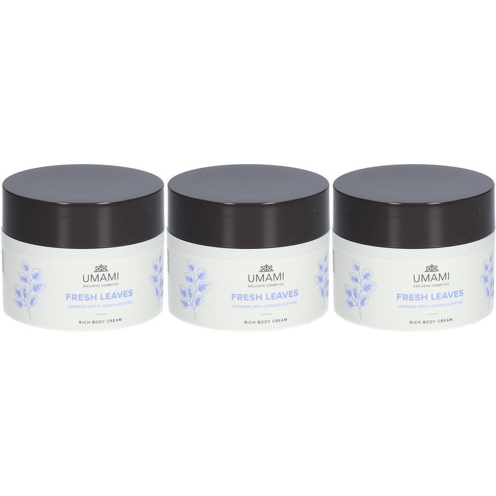 Trois pots de crème pour le corps UMAMI Fresh Leaves. Pots blancs avec couvercles marron et motif floral.