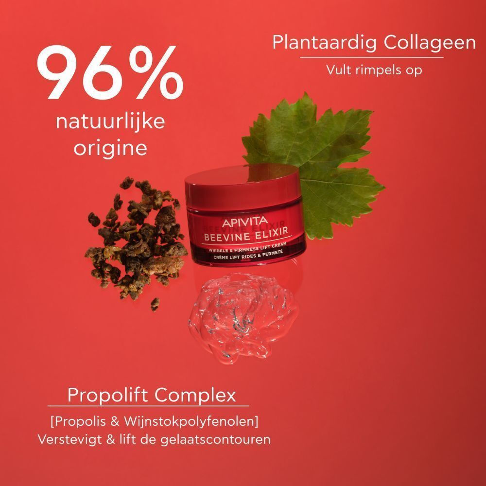 Crèmepotje met rode deksel. Tekst: APIVITA BEEVINE ELIXIR. 96% natuurlijke oorsprong. Op rode achtergrond.