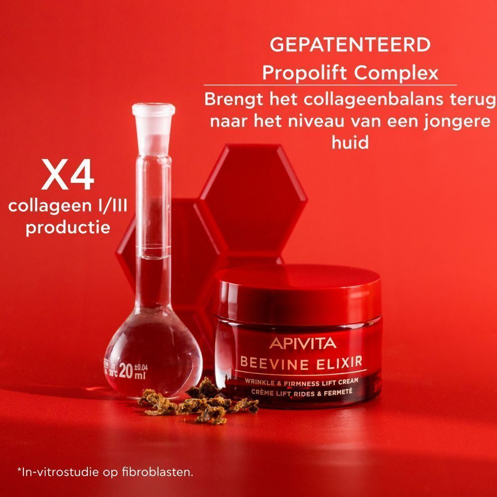 Crèmepotje met rode deksel. Tekst: APIVITA BEEVINE ELIXIR. Op rode achtergrond. Laboratoriummateriaal.
