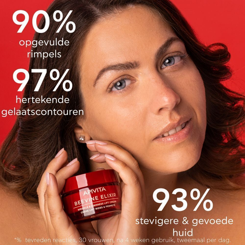 Vrouw met crèmepotje. Tekst: APIVITA BEEVINE ELIXIR. Op rode achtergrond. Percentages.