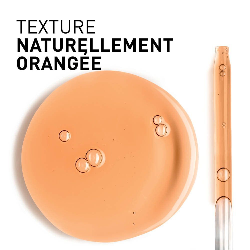 Gros plan d'un échantillon de sérum orange et d'une pipette. Texte: TEXTURE NATURELLEMENT ORANGEE.