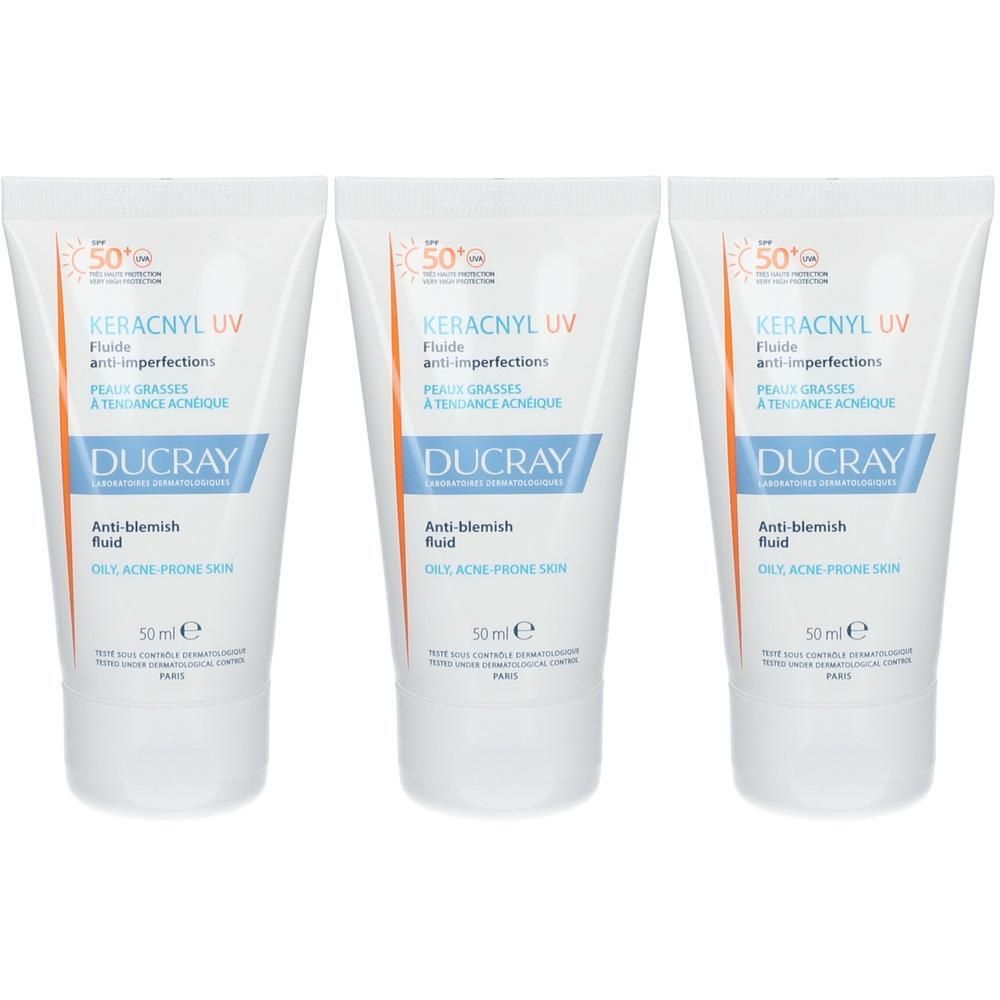 Trois tubes de Ducray Keracnyl UV Fluide. Blancs, avec texte bleu et orange. Texte: Anti-imperfections, SPF 50+.