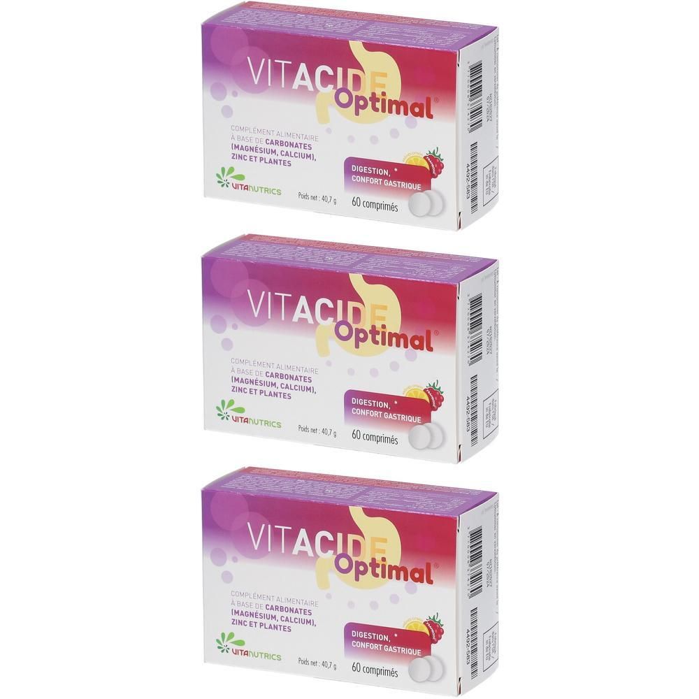 Trois boîtes de Vitanutrics Vitacide Optimal. Inscription: Digestion, 60 comprimés. Emballage violet, blanc et rouge.