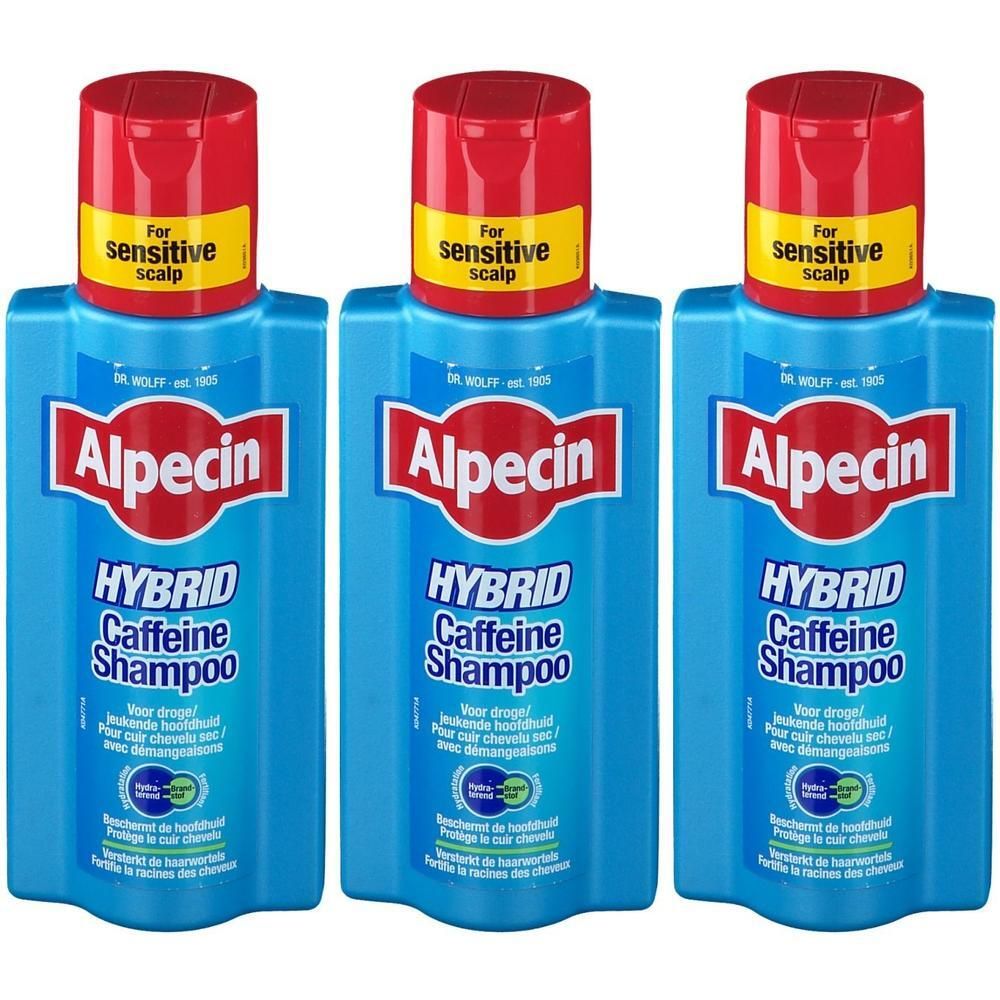 Trois flacons bleus de shampooing Alpecin Hybrid Caffeine. Bouchon rouge, étiquette jaune avec 'sensitive scalp'.