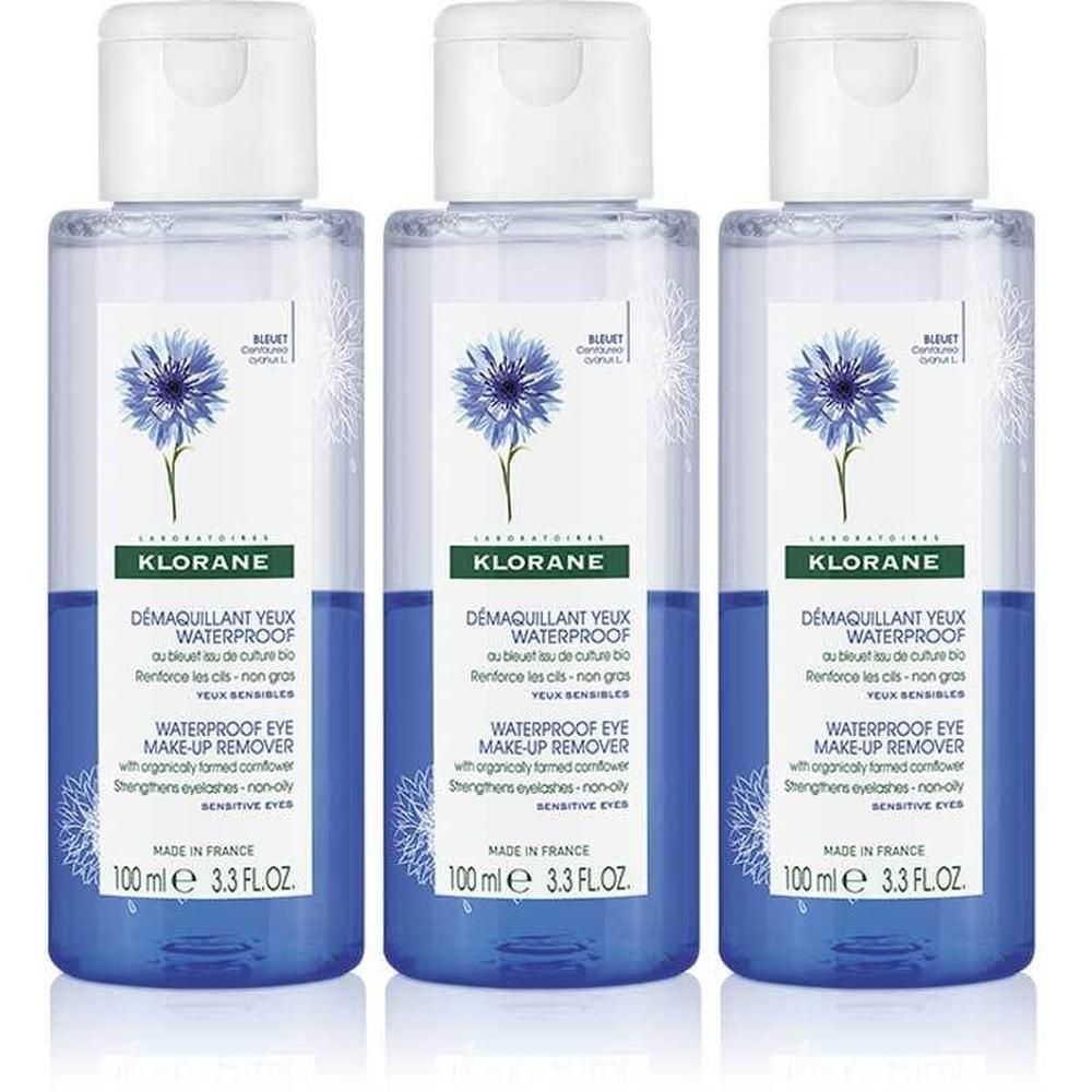Trois flacons de démaquillant pour les yeux Klorane. Liquide bleu dans des flacons transparents avec bouchon blanc. Inscription : Waterproof.