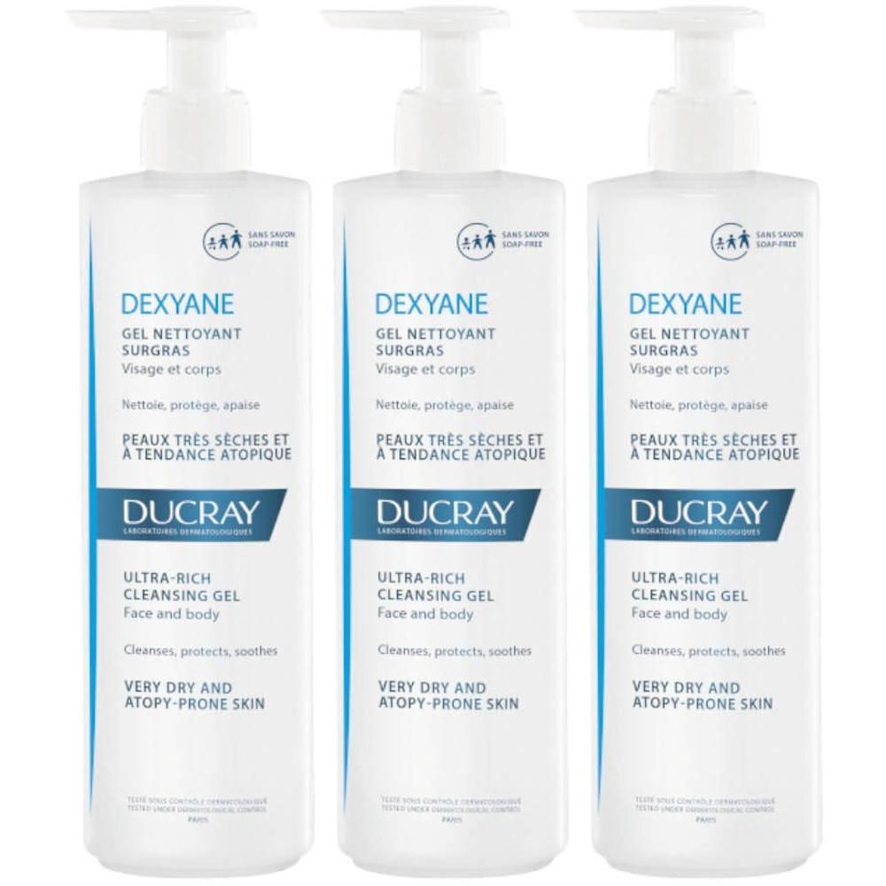 Trois flacons blancs de DUCRAY Dexyane Gel Nettoyant Surgras. Inscription : Ultra-Rich Cleansing Gel, visage et corps, peaux très sèches et à tendance atopique.