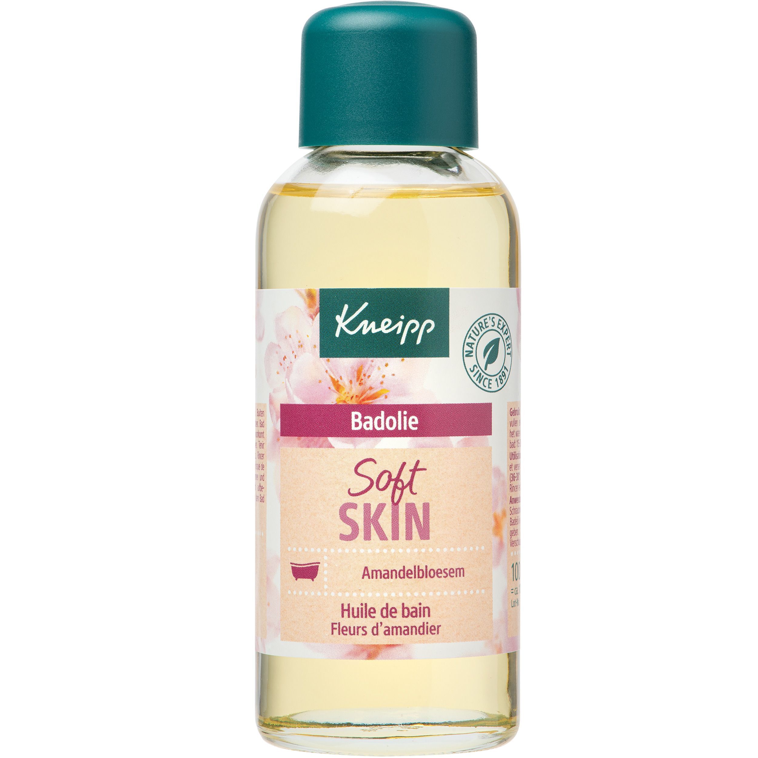 Flacon avec bouchon vert, liquide jaune. Étiquette avec nom du produit et motif floral.