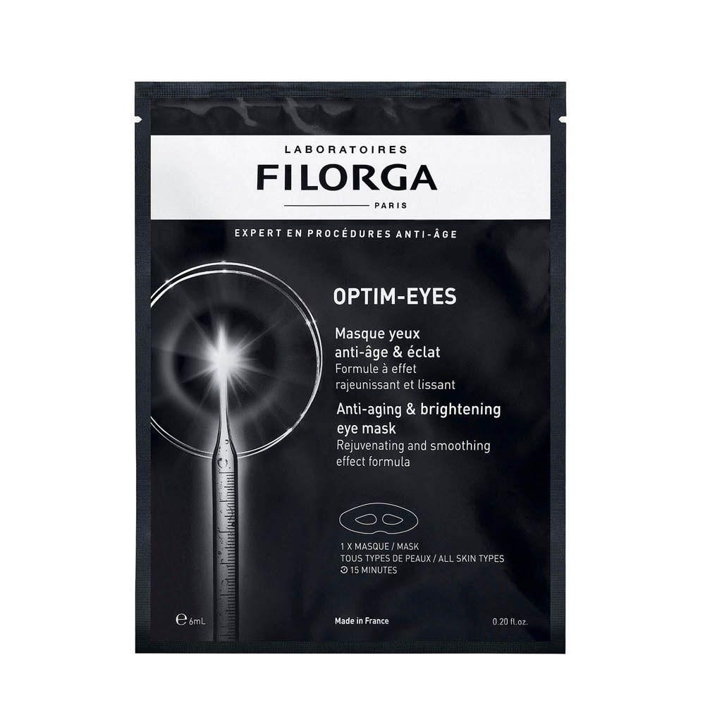 Zwarte verpakking Filorga OPTIM-EYES Masque yeux anti-âge & éclat. Tekst: Anti-aging & brightening eye mask. 1 masker, alle huidtypen.