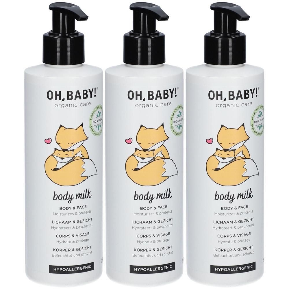 Drie witte flessen met zwarte pomp. Opschrift: OH, BABY! organic care, body milk. Illustratie: vossen. Tekst in het Duits, Frans en Nederlands.