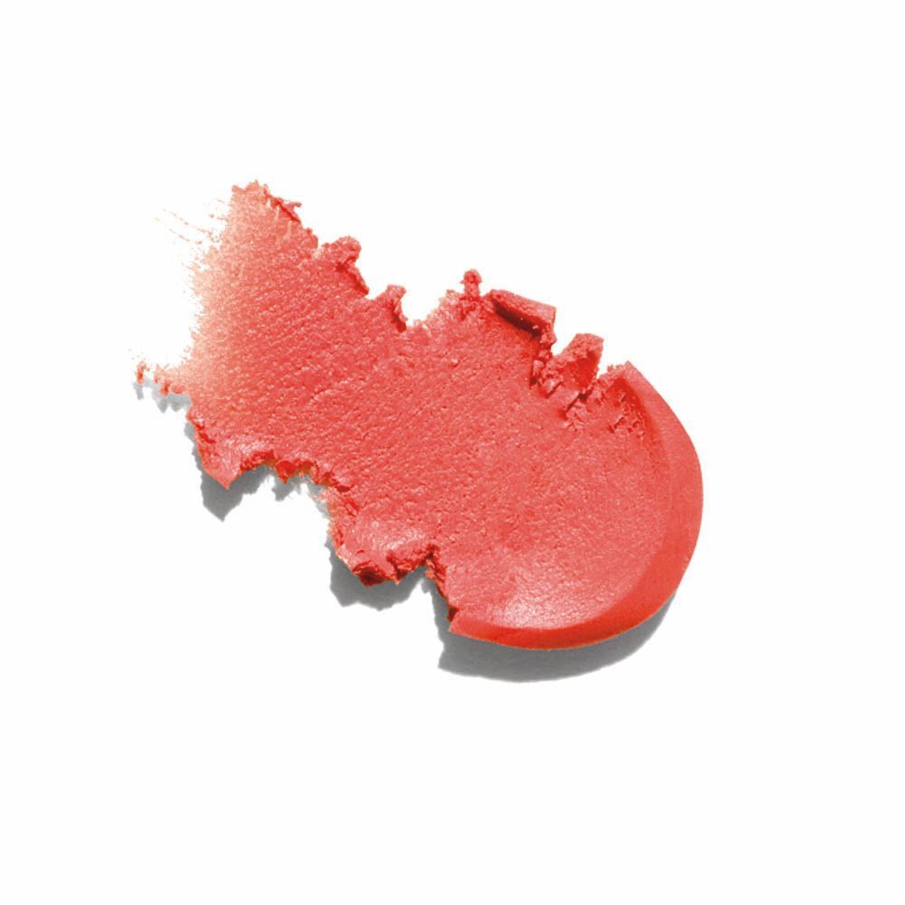Trace de produit rose sur fond blanc.