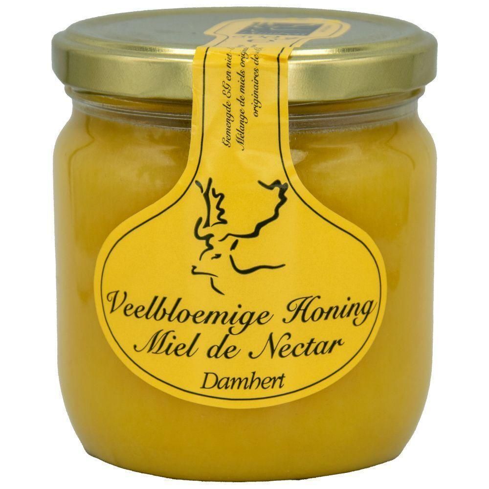 Pot de miel avec étiquette jaune. Texte: Veelbloemige Honing Miel de Nectar Damhert. Couvercle doré.