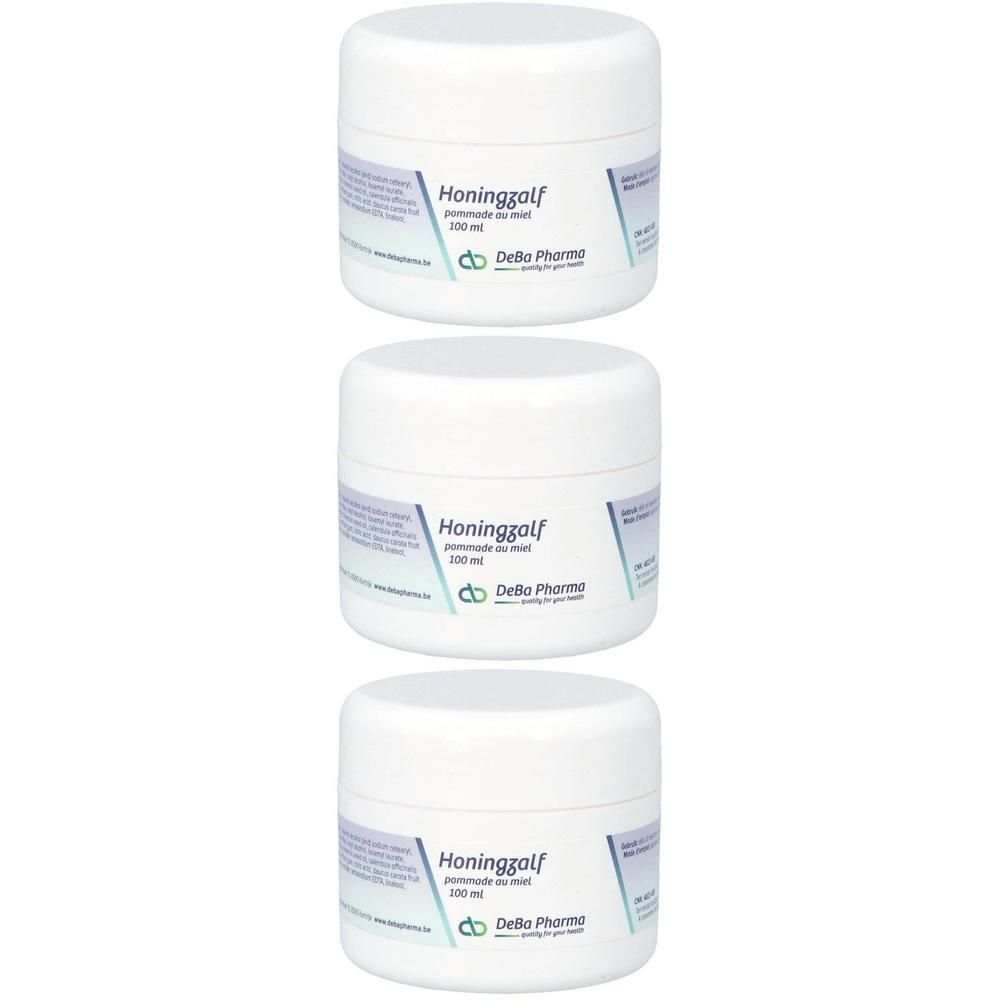 Trois pots blancs avec couvercles. Étiquettes avec "Honingzalf pommade au miel" et "Deba Pharma".