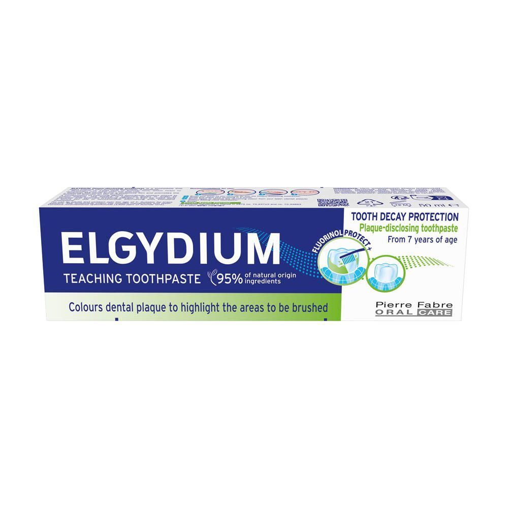 Boîte de dentifrice ELGYDIUM. Texte : Teaching Toothpaste, 95% ingrédients naturels. Protection contre la carie.