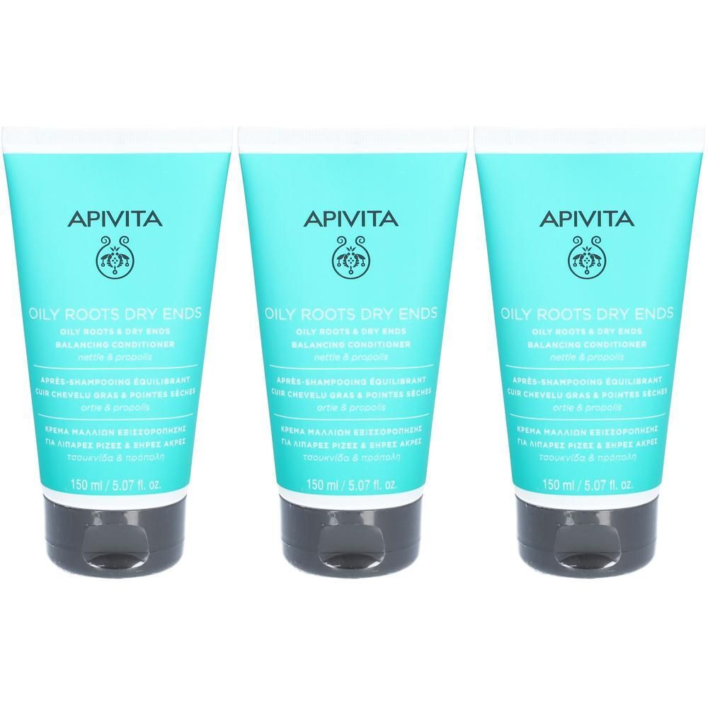 Trois tubes turquoise. Inscription: APIVITA, OILY ROOTS DRY ENDS. Bouchon noir. Texte multilingue.
