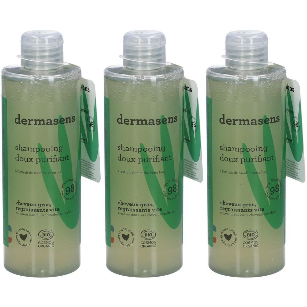 Trois flacons de shampooing Dermasens. Étiquettes vertes avec texte et logo. Liquide transparent.