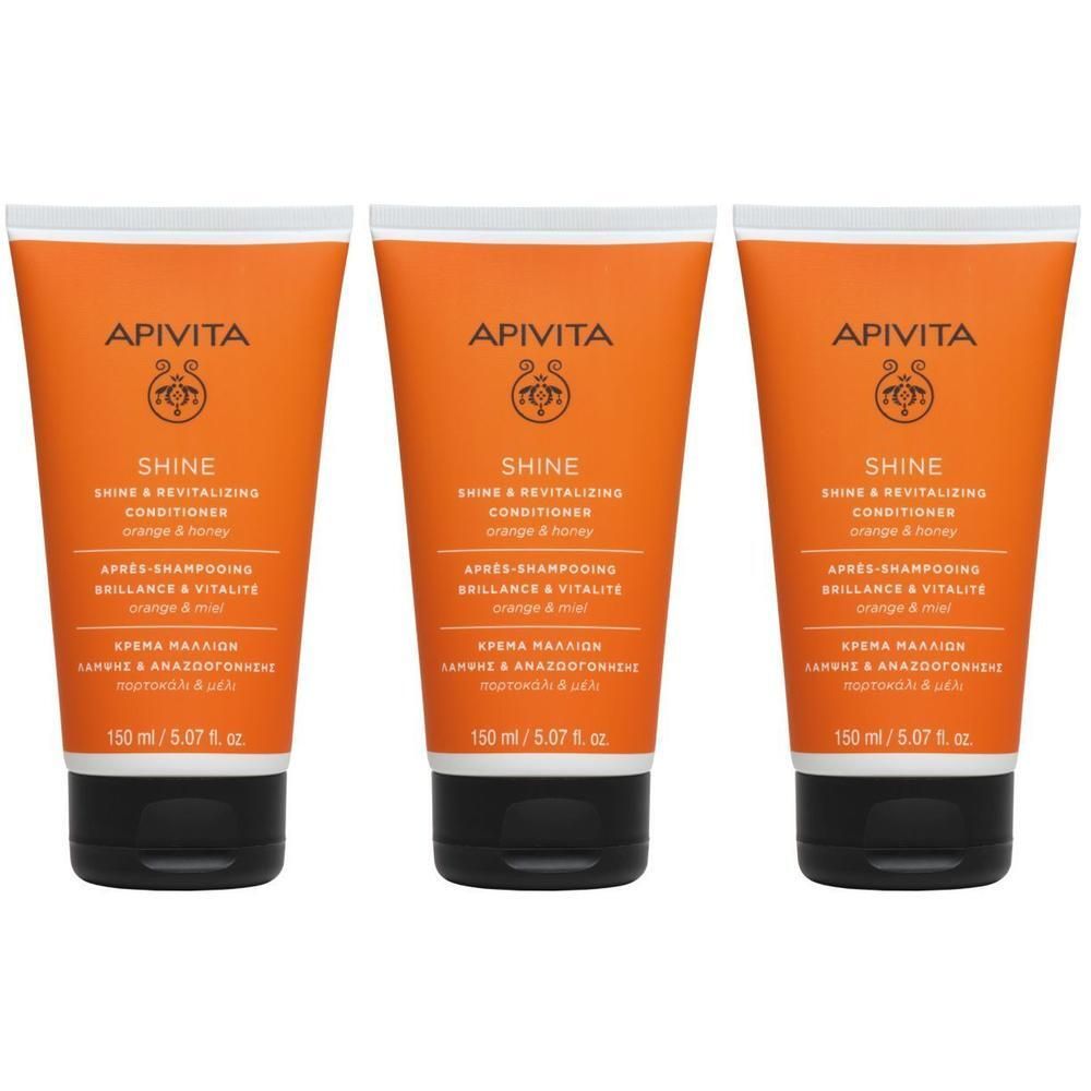 Trois tubes de revitalisant Apivita Shine, orange, bouchon noir. Inscription: Shine, Orange & Honey.