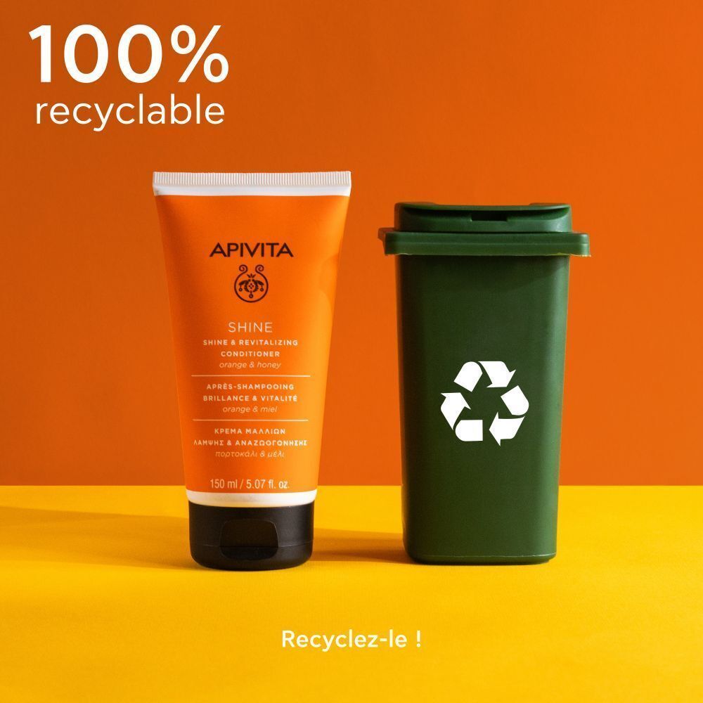 Apivita Shine Conditioner à côté d'une poubelle verte avec symbole de recyclage. Texte: 100% recyclable.