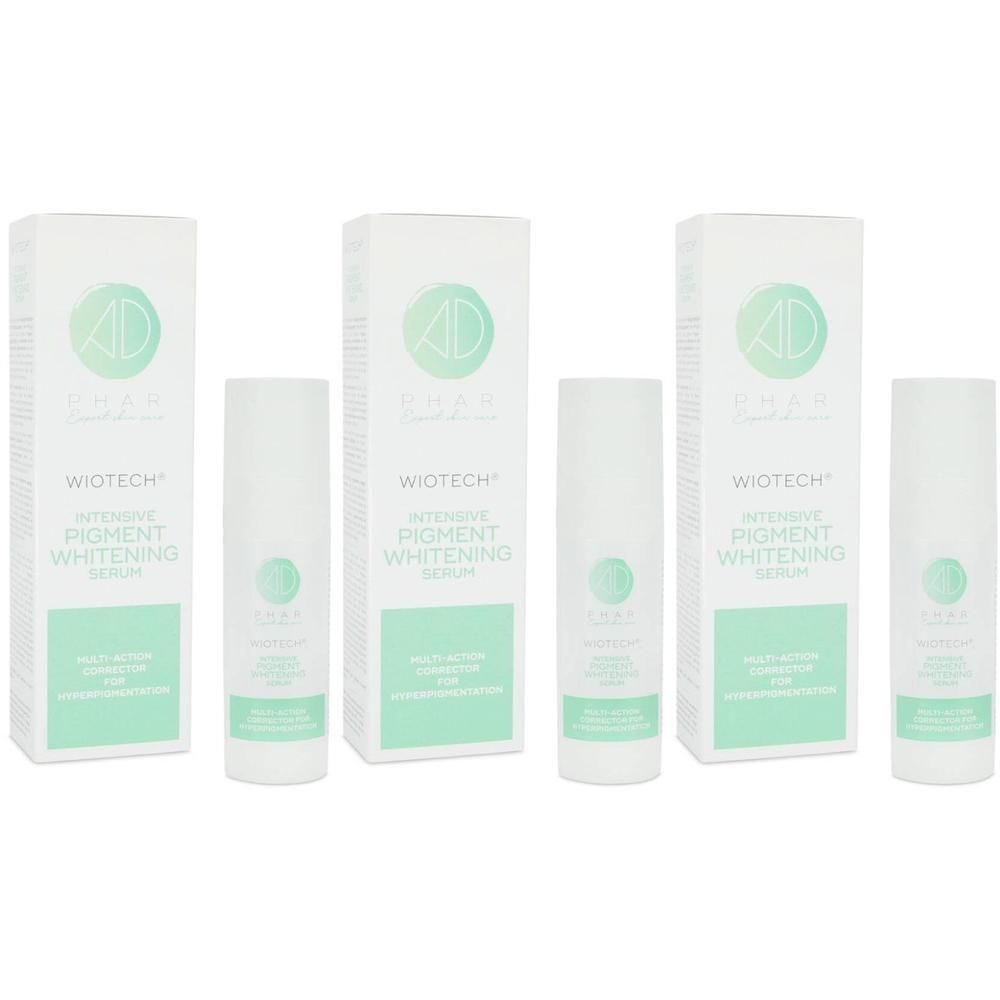 Drie dozen en drie flessen Wiotech Intensive Pigment Whitening Serum. Witte verpakking met groene accenten en productnaam.