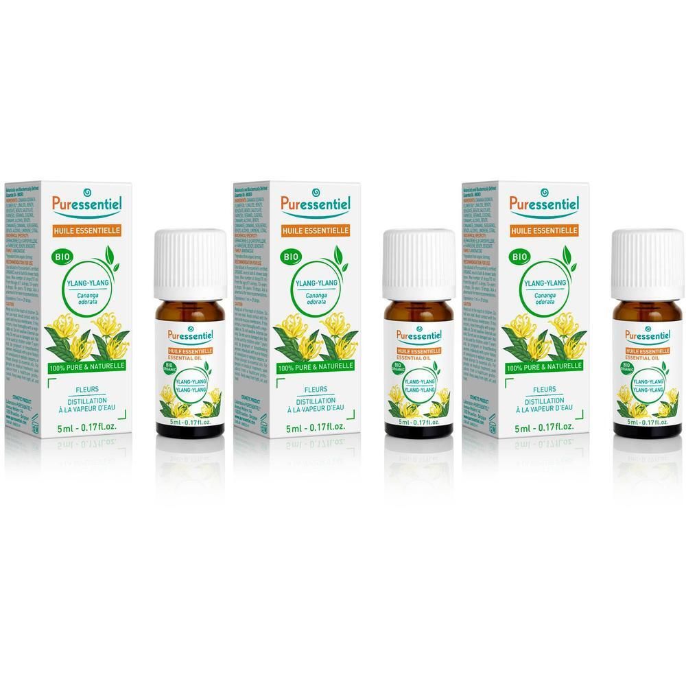 Plusieurs flacons et boîtes. Inscription : Puressentiel, Bio, Ylang-Ylang, 100% pur & naturel, 5ml.