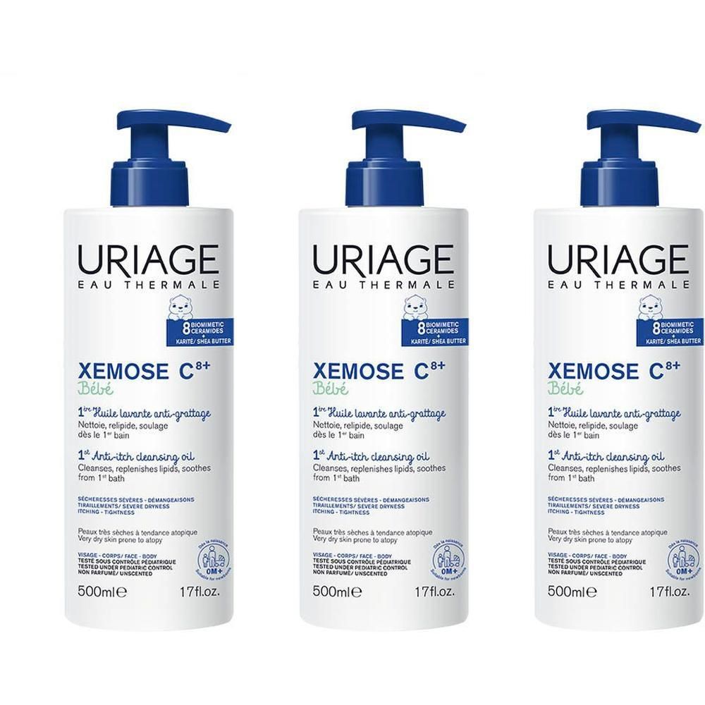Drie witte flessen met blauwe pomp. Opschrift: Uriage Eau Thermale, Xémose C8+ Bébé.
