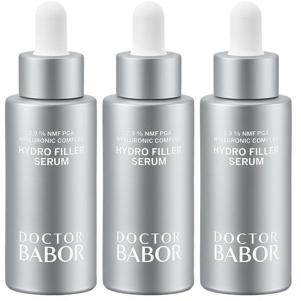 Drie zilverkleurige flacons met witte pipetten. Op elke flacon staat "HYDRO FILLER SERUM" en "DOCTOR BABOR".