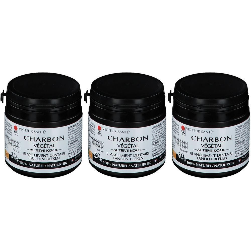 Trois pots noirs avec couvercles. Étiquettes avec "Charbon Végétal" et "Blanchiment Dentaire".