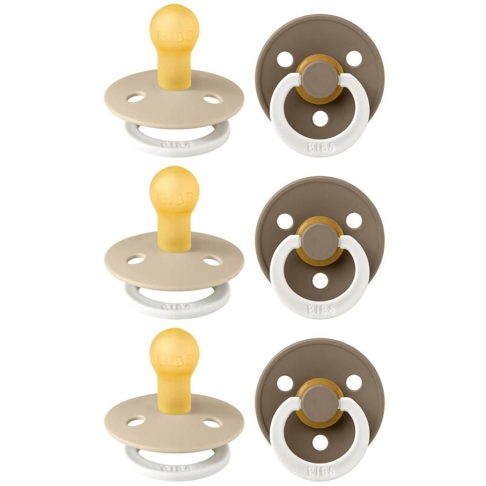 Zes fopspenen in beige en bruin. Ronde vorm met latex speen en schild. Witte ringen.