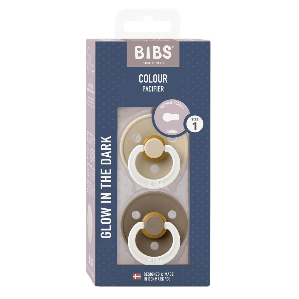 Emballage avec deux sucettes. Beige et marron. Marque BIBS. 'Glow in the Dark' et taille 1.
