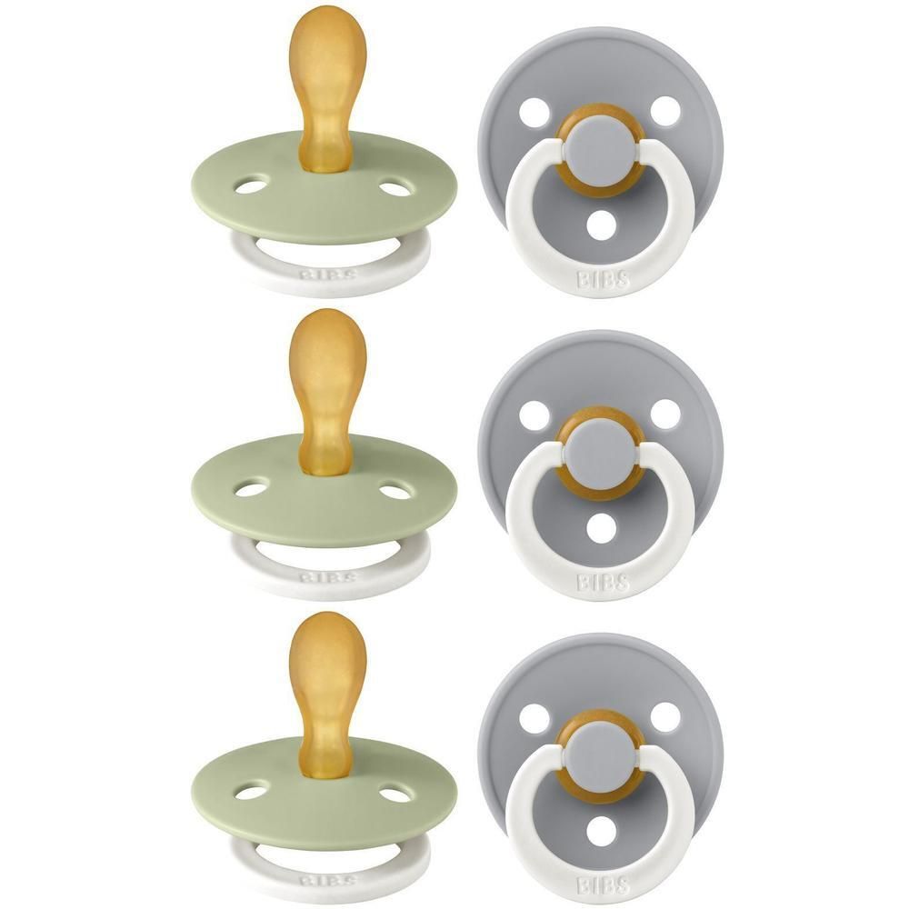 Six sucettes symétriques vertes et grises. Boucliers ronds, anneaux blancs et tétines jaunes. Logo BIBS visible.