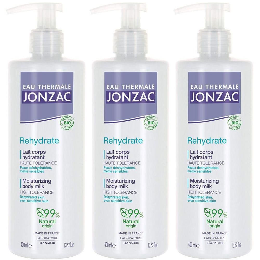 Trois flacons blancs avec pompe. Sur chaque flacon, on lit "EAU THERMALE JONZAC Rehydrate Lait corps hydratant".