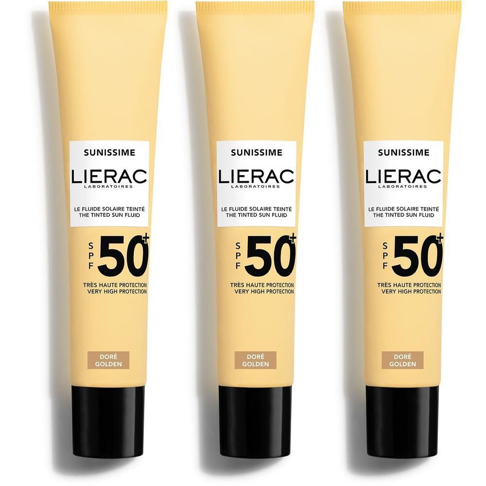 Trois tubes de Lierac Sunissime Le Fluide Teinté SPF50+. Beige, bouchon noir. Inscription: SPF 50, Très haute protection.