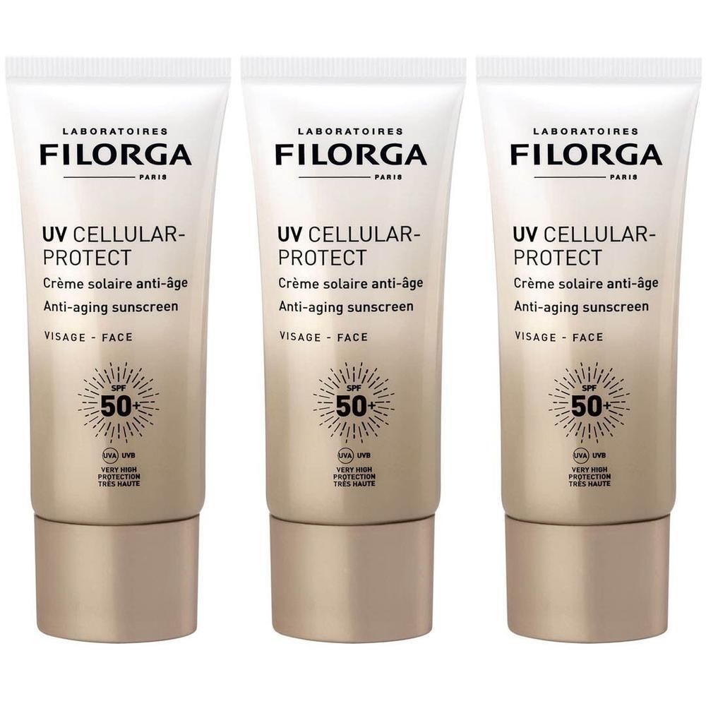 Trois tubes de Filorga UV CELLULAR-PROTECT. Tubes blanc et or avec informations produit et SPF 50.
