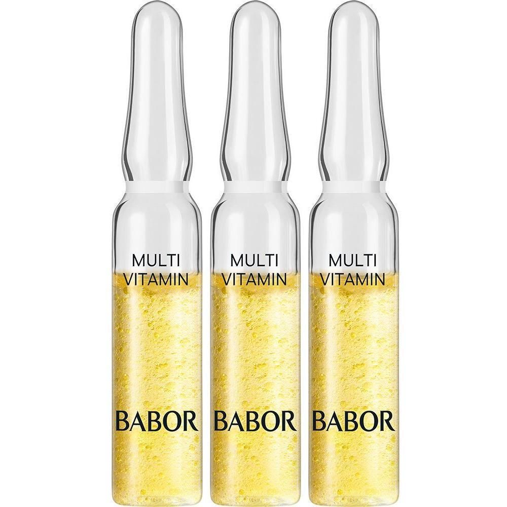 Drie ampullen met gele vloeistof. Opschrift "MULTI VITAMIN" en "BABOR".